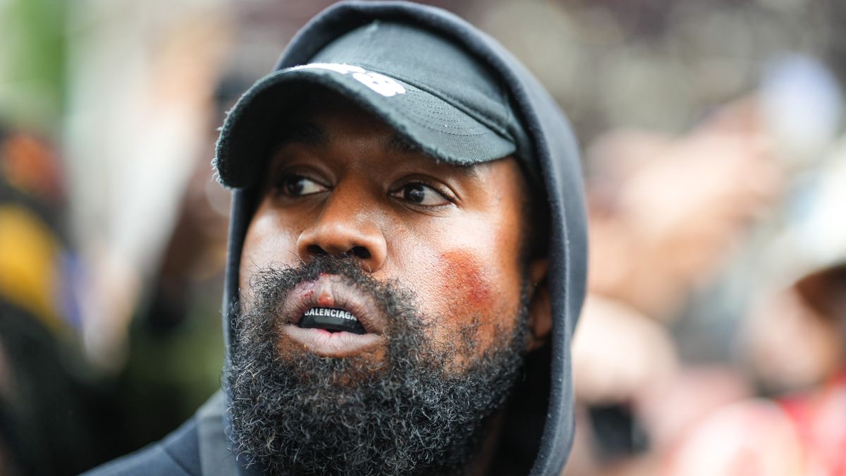 PARIS, FRANCE - OCTOBER 02: Kanye West aka Ye is seen wearing a Balenciaga boxing mouthguard, outside Givenchy, during Paris Fashion Week - Womenswear Spring/Summer 2023 - Day Seven on October 02, 2022 in Paris, France. (Photo by Edward Berthelot/GC Images)