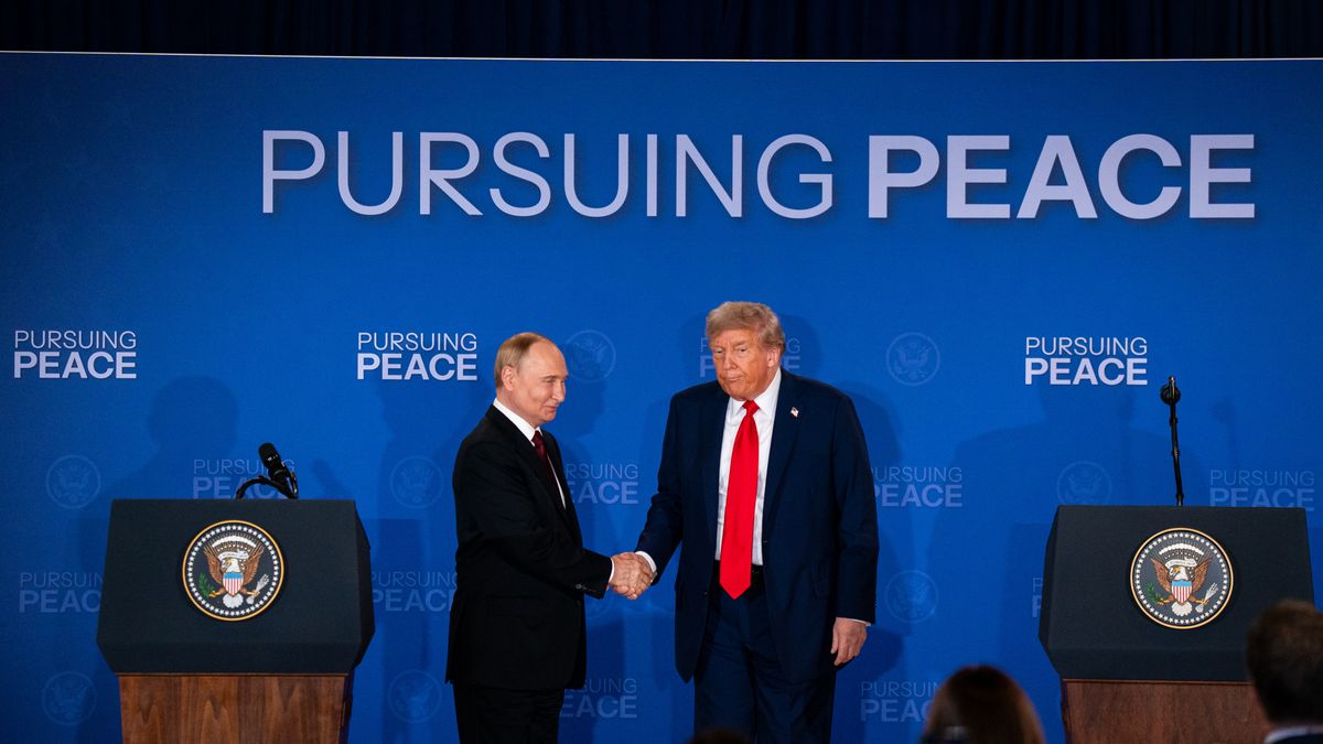 Vladimir Putin, Russia's president, left, and US President Donald Trump shake hands during a joint news conference at Joint Base Elmendorf-Richardson in Anchorage, Alaska, US, on Friday, Aug. 15, 2025. Discussions between President Donald Trump and Russian counterpart Vladimir Putin concluded after more than two-and-a-half hours at their summit in Alaska, marking their longest in-person meeting and offering a sign that by the US leader's own metric the talks have gone well. Photographer: Al Drago/Bloomberg via Getty Images