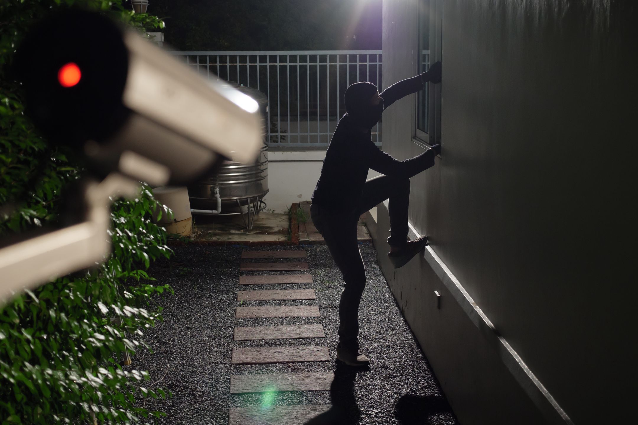 Thief wearing black suit with balaclava and glove being caught by CCTV, surveillance camera during sneak into a house at night
alarm, balaclava, bandit, black, break, burglar, burglary, camera, capture, cctv, circuit, climb, close, crime, criminal, crowbar, dangerous, dark, electronic, evidence, glove, home, house, housebreaker, illegal, man, mask, monitoring, night, overhead, prevent, protection, record, risk, rob, robber, safety, security, sneak, stealing, surveillance, system, technology, television, theft, thief, video, window