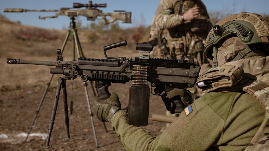 DONETSK REGION, UKRAINE - OCTOBER 26: Andrii, a soldier shoots with a US-made light machine gun, M249 SAW known as Minimi as a drone unit from a battalion of the 24th Brigade of the Ukrainian Armed Forces receives training on shooting with various weapons, medical evacuations, and tactical medicine deployment in Donetsk region, Ukraine on October 26, 2024. (Photo by Andre Luis Alves/Anadolu via Getty Images)