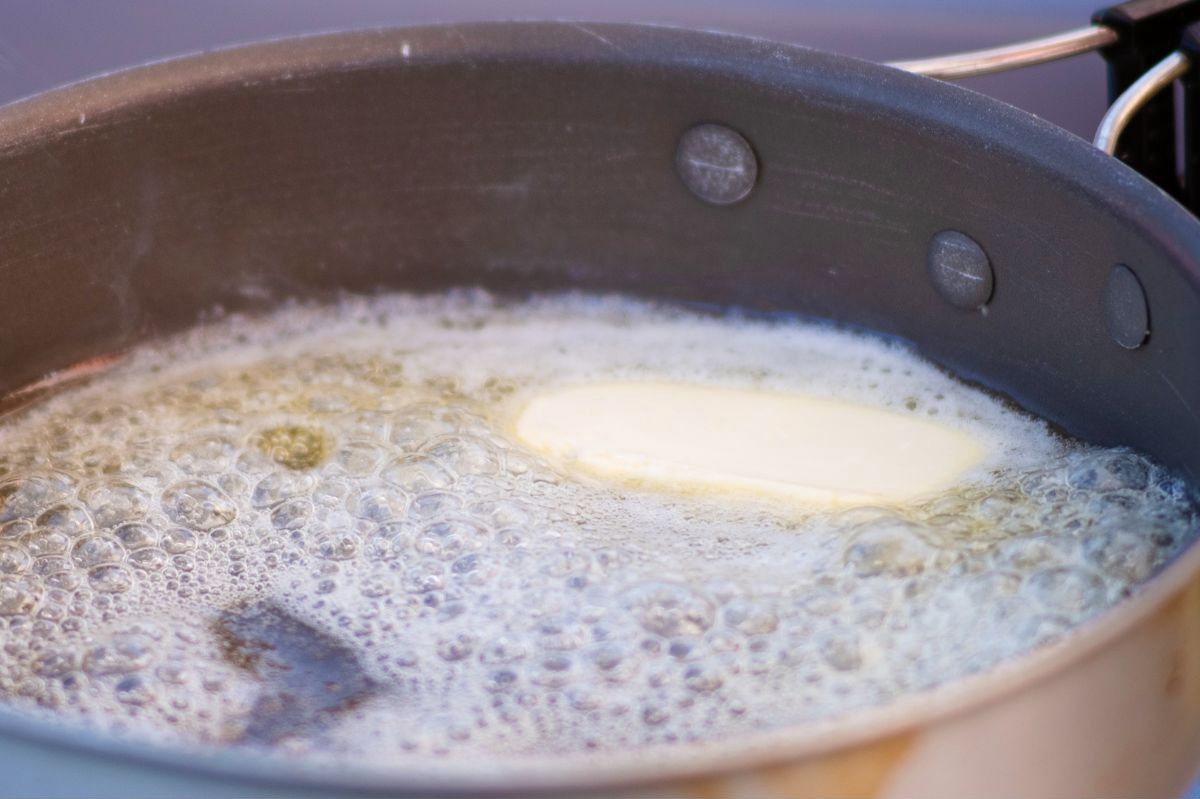 White foam often appears on heated butter.