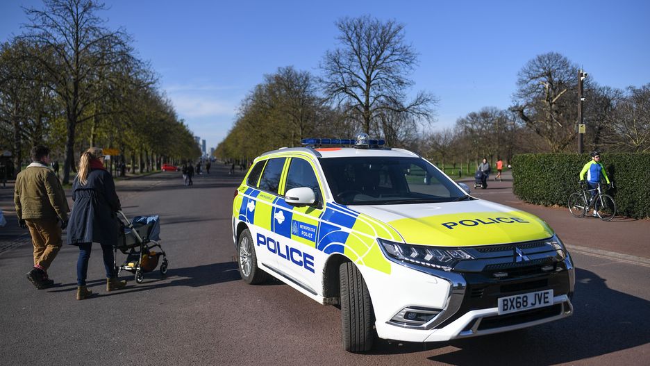 LONDON, ENGLAND  - MARCH 22: A Police car is seen parked at the gates to Greenwich Park on March 22, 2020 in London, United Kingdom. British Prime Minister Boris Johnson urged that people don't visit their parents this Mothering Sunday to curb the spread of COVID-19, which has killed 233 people in the UK.  (Photo by Peter Summers/Getty Images)