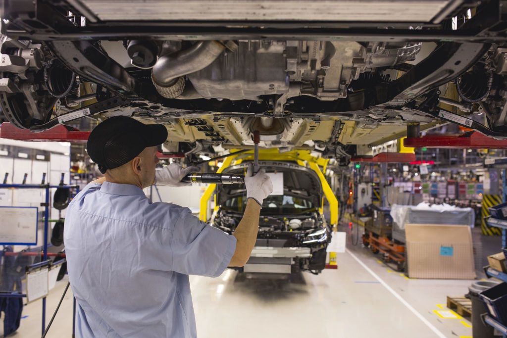Opel Automobile Manufacture In Poland
A worker fits parts to the underside of a raised Opel Astra automobile on the production line at the Opel automobile plant in Gliwice, Poland, on Monday, March 6, 2017. The maker of Peugeot and Citroen cars will pay 1.8 billion euros ($1.9 billion) for GMs Opel unit and its U.K. sister brand Vauxhall, as the French manufacturer bolsters its defenses in a peaking market thats being transformed by technology, new competitors and Brexit. Photographer: Bartek Sadowski/Bloomberg via Getty Images
Bloomberg
Industry, Industrial, Manufacturing, Cars, Fabrication, Automotive, Automobiles, Manufacture