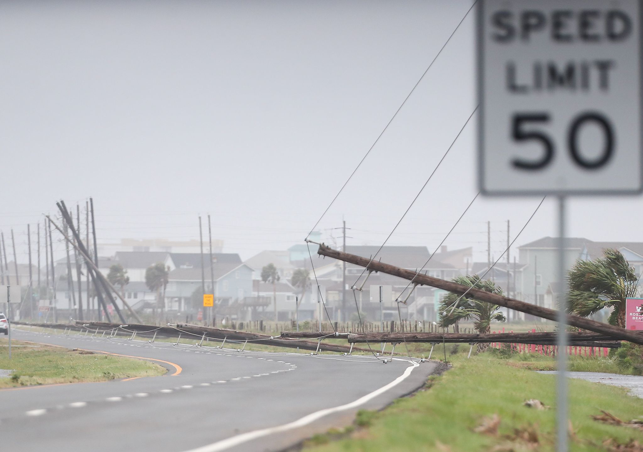 GALVESTON, TEXAS - JULY 8: Fallen power lines on Termini San Louis Pass Road on Galveston Island as a result of Hurricane Beryl on Monday, July 8, 2024. (Elizabeth Conley/Houston Chronicle via Getty Images)
