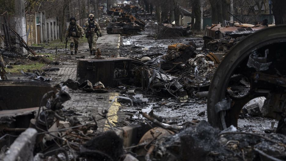 TemporarySoldiers walk amid destroyed Russian tanks in Bucha, on the outskirts of Kyiv, Ukraine, Sunday, April 3, 2022. (AP Photo/Rodrigo Abd)AP