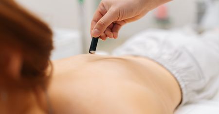 What is moxibustion? What does moxa involve?