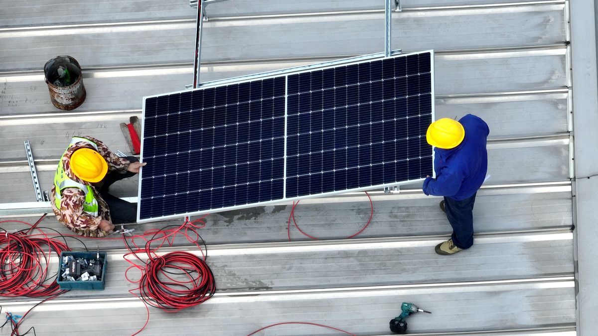 HAIAN, CHINA - APRIL 11, 2024 - Workers install solar photovoltaic panels on the roof of a factory in Haian, Jiangsu province, April 11, 2024. (Photo credit should read CFOTO/Future Publishing via Getty Images)