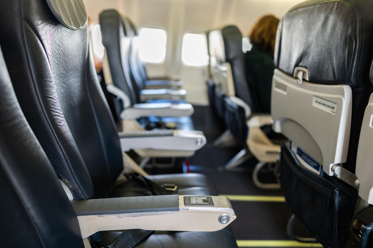 Why the airplane seat you hate is actually the best