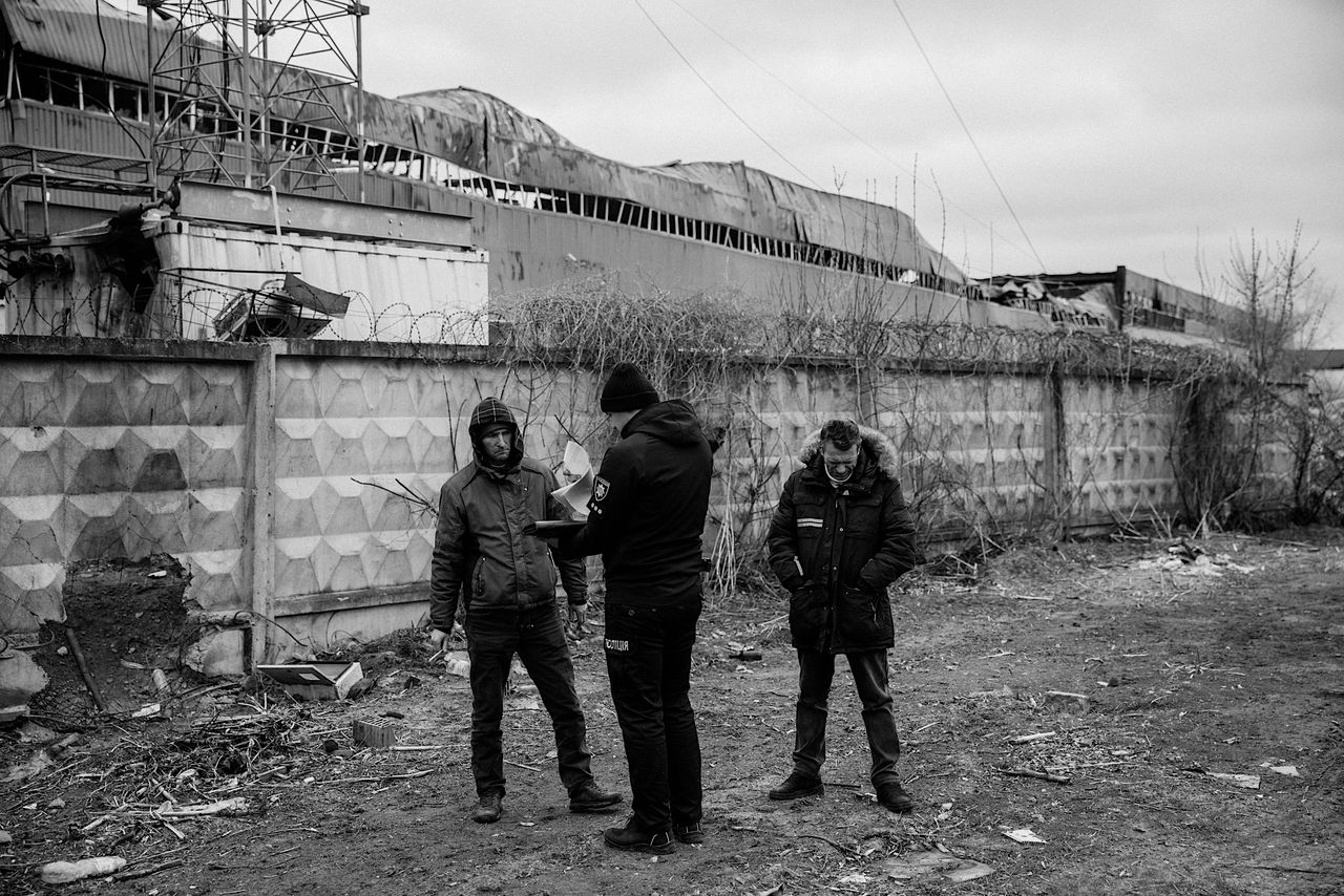 Maksym (right) during the exhumation of his mother’s body