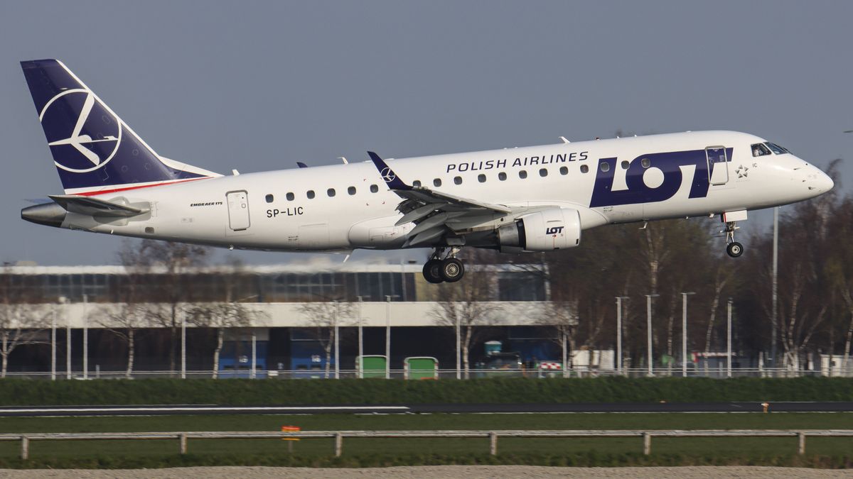 Polish Airlines LOT Embraer ERJ-175 aircraft as seen on final approach flying, arriving for landing at the runway of Amsterdam Schiphol AMS EHAM Airport. The Brazilian-made narrow body airplane is a regional Embraer ERJ 175 with the registration SP-LIC. LOT Polish Airlines, legally incorporated as Polskie Linie Lotnicze LOT S.A. is the flag carrier airline of Poland and a member of the Star Alliance aviation group. The aviation industry and passenger traffic are phasing a difficult period with the Covid-19 coronavirus pandemic having a negative impact on the travel business industry with fears of the deteriorating situation due to the new Omicron variant mutation. Amsterdam, the Netherlands on April 1, 2021 (Photo by Nicolas Economou/NurPhoto via Getty Images)