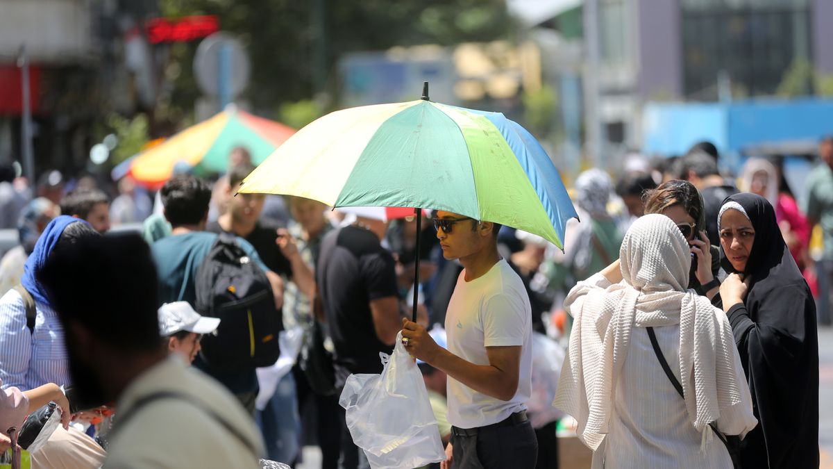 Two-day holiday due to scorching heat in Iran
TEHRAN, IRAN - AUGUST 02: People use umbrellas to shield from the sun on a calm day during the two-day holiday over extreme heat in Tehran, Iran on August 02, 2023. Starting from today, Iran announces two days off for the whole country, where in southern parts temperatures reach up to 50 degrees Celcius. (Photo by Fatemeh Bahrami/Anadolu Agency via Getty Images)
Anadolu
extreme, heat, hot, soaring temperatures