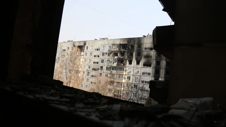 MARIUPOL, UKRAINE - MARCH 24: A view from a damaged building as civilians are being evacuated along humanitarian corridors from the Ukrainian city of Mariupol under the control of Russian military and pro-Russian separatists, on March 24, 2022. (Photo by Leon Klein/Anadolu Agency via Getty Images)