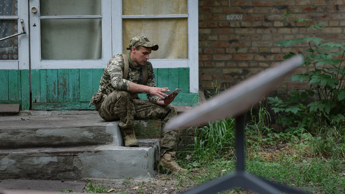 DNIPROPETROVSK REGION, UKRAINE - JUNE 15: Former prisoner with the call sign "Lyolik" who signed a contract to join the Ukrainian army use mobile to connect to the StarLink at the base of the first assault battalion named after "Da Vinci" on June 15, 2024 in Dnipropetrovsk region, Ukraine. A law adopted by parliament in May has allowed some convicted criminals to win early release by enlisting in Ukraine's assault brigades. The prisoners released through the amnesty program can only join the frontline infantry roles and will join units made up solely of former prisoners. Before seeing the frontline, however, the former prisoners will train in basic tactical skills, assembly and disassembly of weapons, and physical exercises. This is followed by the Ukrainian army's five-week basic training course, after which the new recruits will join the combat units. (Photo by Andriy Dubchak/Frontliner/Getty Images)