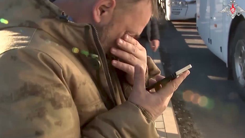 Temporary
In this handout photo taken from video released by Russian Defense Ministry Press Service on Tuesday, Dec. 6, 2022, a Russian reacts as he speaks on the phone with his relative after being released in a prisoners swap between Russia and Ukraine somewhere at an unspecified location. Russian and Ukrainian officials on Tuesday reported that Russia released 60 Ukrainian soldiers, while Ukraine turned over the same number of Russian troops. (Russian Defense Ministry Press Service via AP)