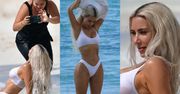 Kim Kardashian z poświęceniem wije się na plaży, prezentując rozmaite pozy... (ZDJĘCIA)