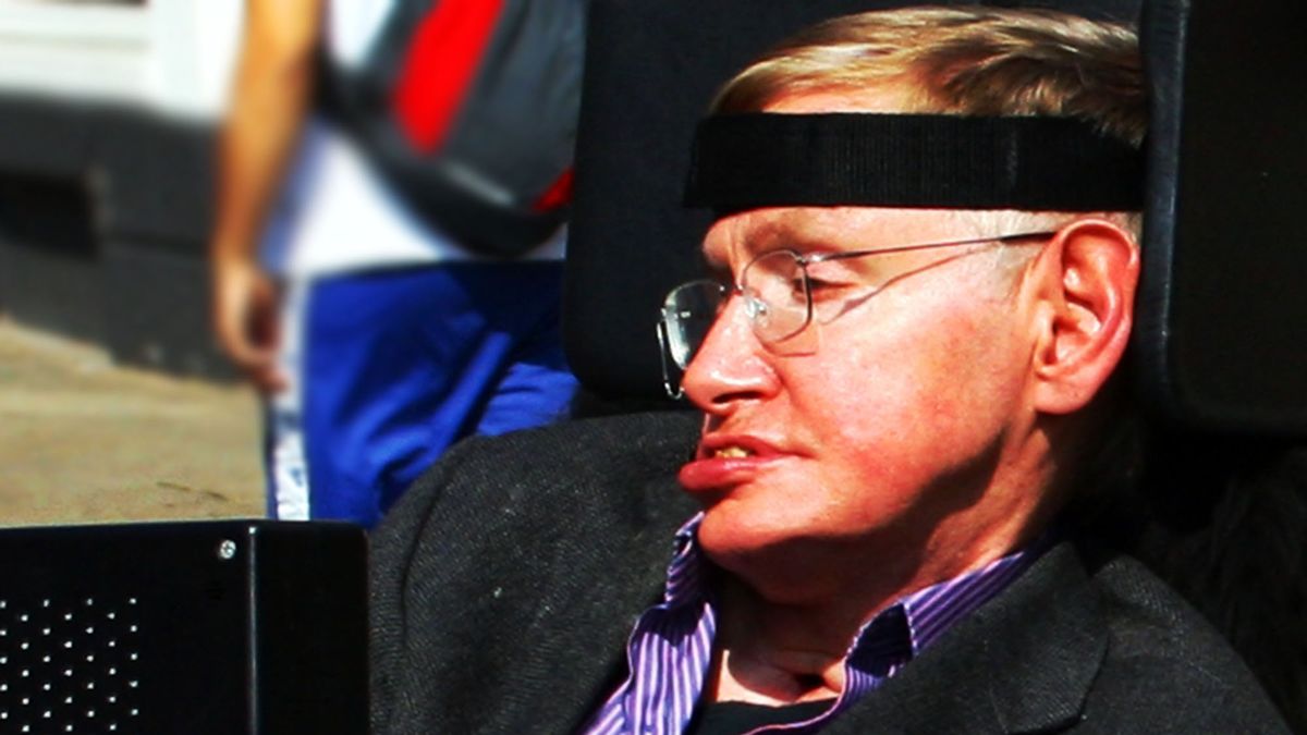 Picture Shows:  Stephen Hawking on set of BBC Two drama 'Hawking'.TX: BBC TWO TBCThe story of the early years of world-renowned theoretical physicist Stephen Hawking, is to be made into a one-off drama for BBC Two. Written by Peter Moffatt (Cambridge Spies), Hawking stars Benedict Cumberbatch as the young Stephen Hawking who, as a bright and ambitious PHD student at Cambridge University, is diagnosed with the debilitating motor neurone disease and given two years to live. Against the odds, he goes on to achieve worldwide acclaim and success, in particular with his astounding book A Brief History Of Time.  Warning: Use of this copyright image is subject to Terms of Use of BBC Digital Picture Service.  In particular, this image may only be used during the publicity period for the purpose of publicising [BBC programme or BBC person��s name or other BBC output/activity here] and provided [BBC or other copyright owner] is credited. Any use of this image on the internet or for any other purpose whatsoever, inc