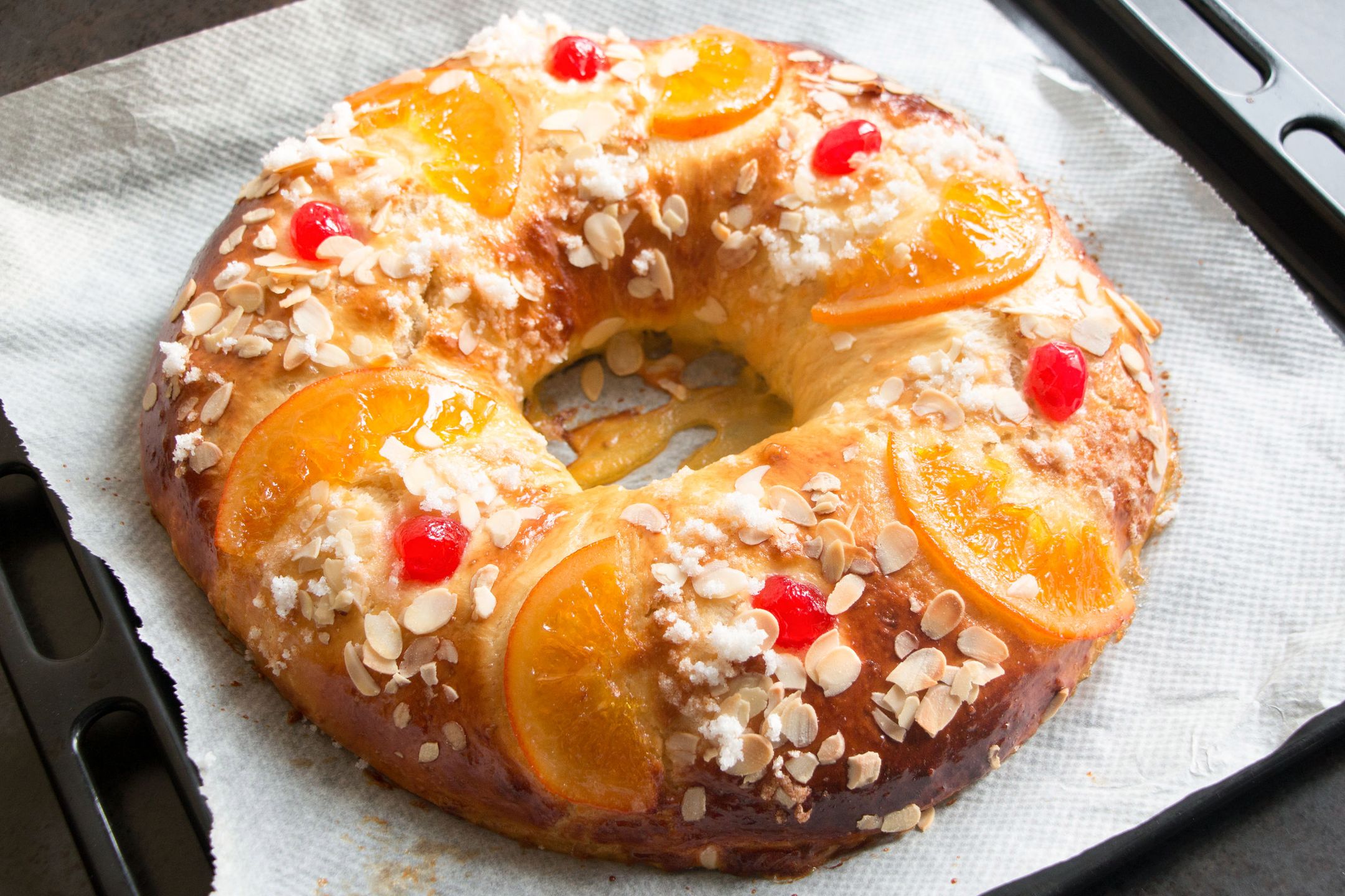 Homemade "Roscon de reyes" , Spanish typical dessert of Epiphany, in the oven plate