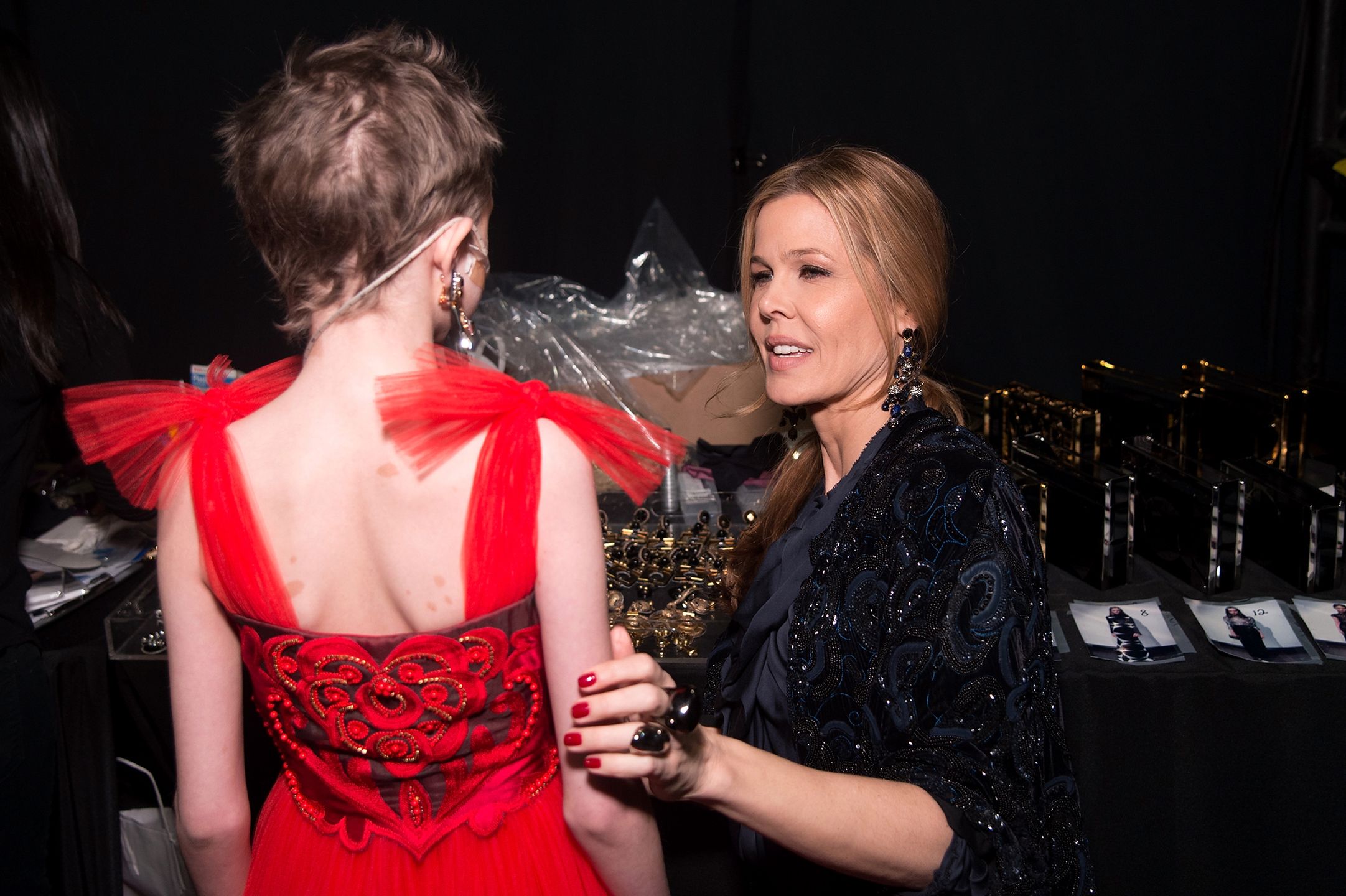A model prepares backstage at the Naeem Khan Fall 2016 fashion show during New York Fashion Week: The Shows at The Arc, Skylight at Moynihan Station on February 17, 2016 in New York City. 
