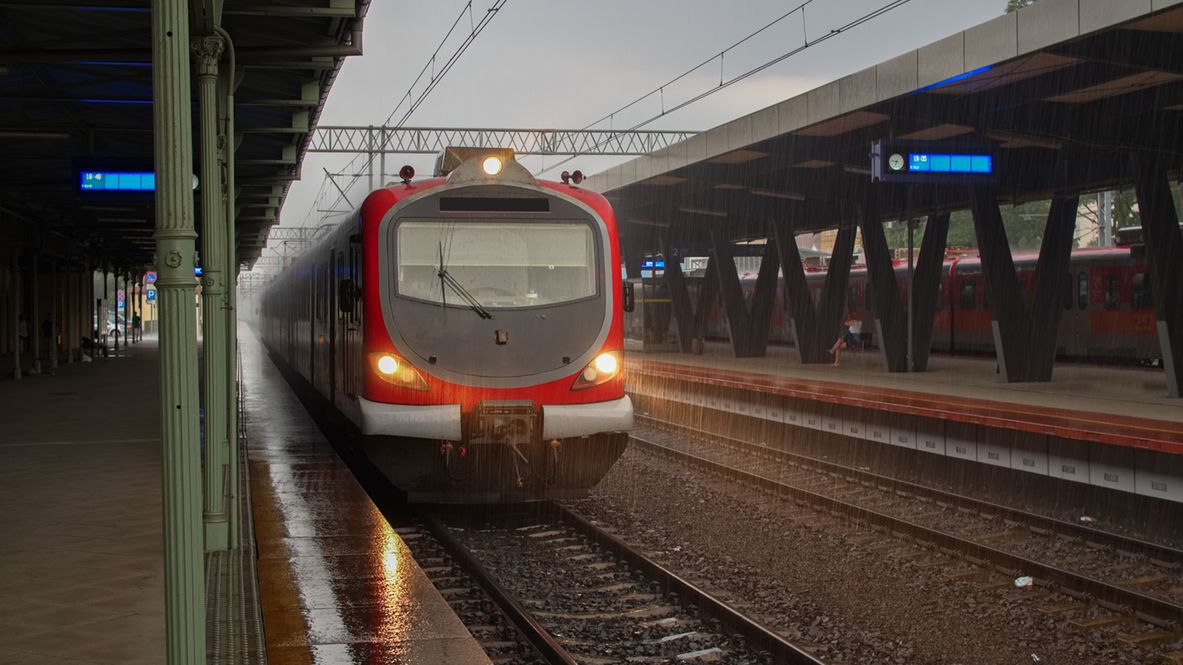 Rainy day modern train waiting station for passengers