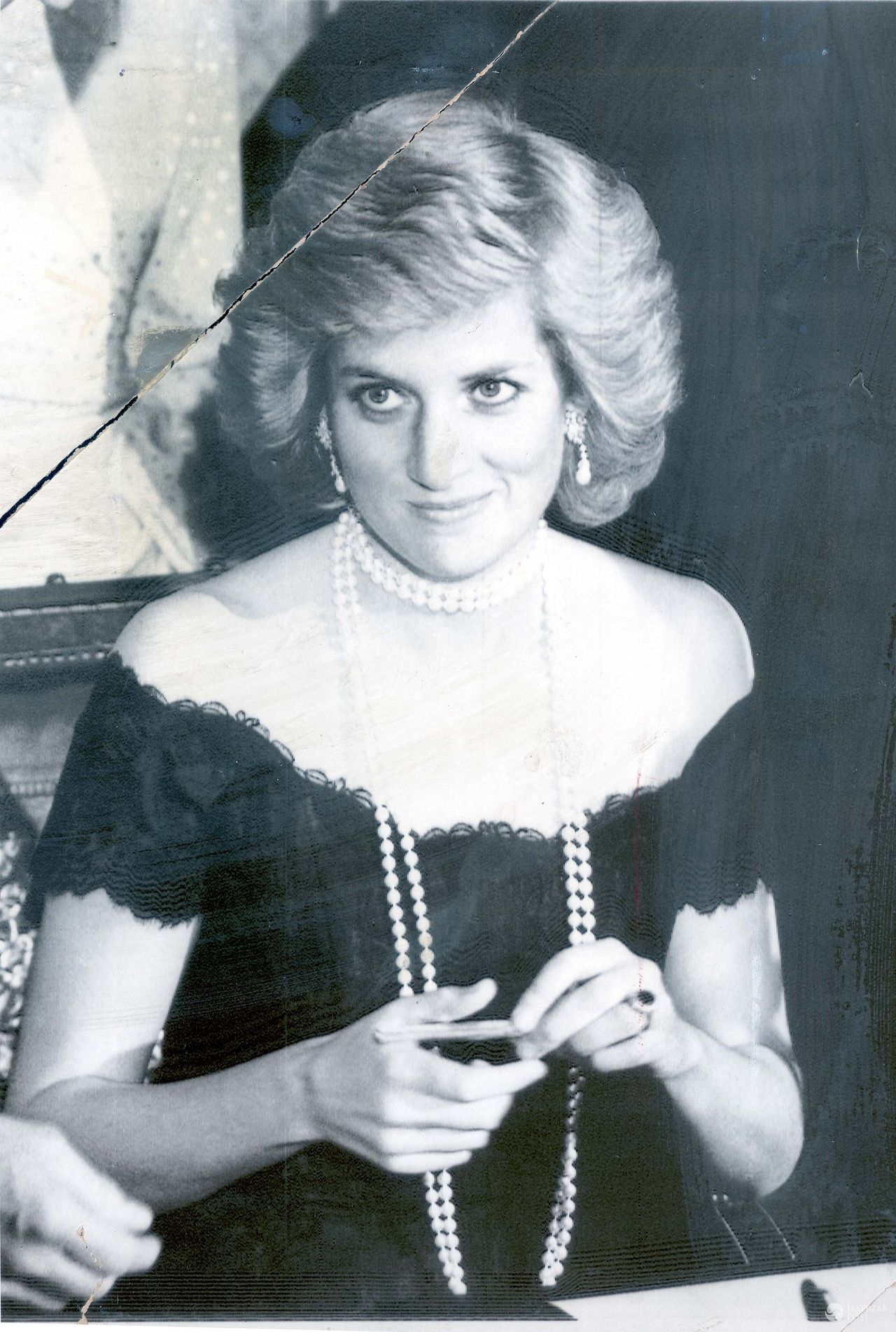 Nov 06, 1987 - Hamburg, London, Germany - With its oval blue sapphire surrounded by a cluster of 14 diamonds, the ring Prince William has given Kate Middleton is among the most famous in the world. Lady Diana Spencer chose it for her engagement to Prince Charles in 1981 from a selection presented to her by the then Crown jewellers Garrard of Mayfair. It cost £28,500 but, unusually for a choice by a member of the Royal Family, it was not unique and any member of the public could buy the same ring from the Garrard catalogue.PICTURED:-  PRINCESS DIANA has a double-row string of pearls around her neck as she is dressed in a strapless gown during a reception at the Hamburg City Hall, Friday night, upon the visit of the royal couple to this town.

(Credit Image: © Mike Forster/Daily Mail/SOLO Syndication)