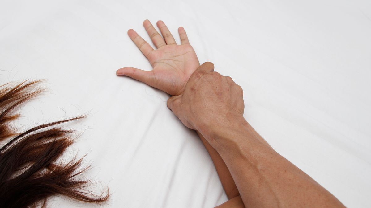 A hairy man's hand holding a woman hand for rape and sexual abuse concept                               