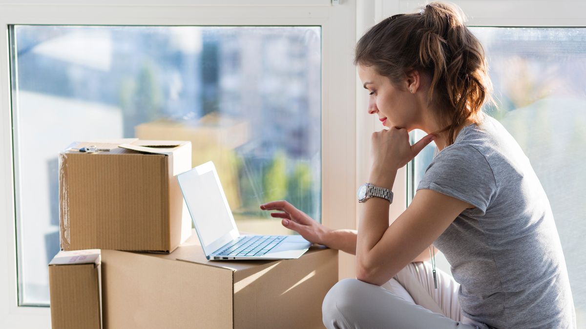 Beautiful girl moving in the new apartment