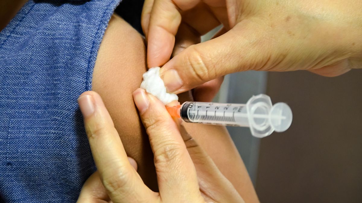 Children receiving vaccine at shoulder .Children vaccine.