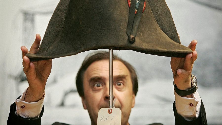 LONDON - OCTOBER 14:  A bicorn hat, said to have been worn by Napoleon Bonaparte, is readied for display by Nicholas Lambourn at Christie's on October 14, 2005 in London, England. Christie's Trafalgar Bicentenary, The Age of Nelson, Wellington and Napoleon sale takes place on October 19, 2005 in London.  (Photo by Peter Macdiarmid/Getty Images) *** Local Caption *** Nicholas Lambourn