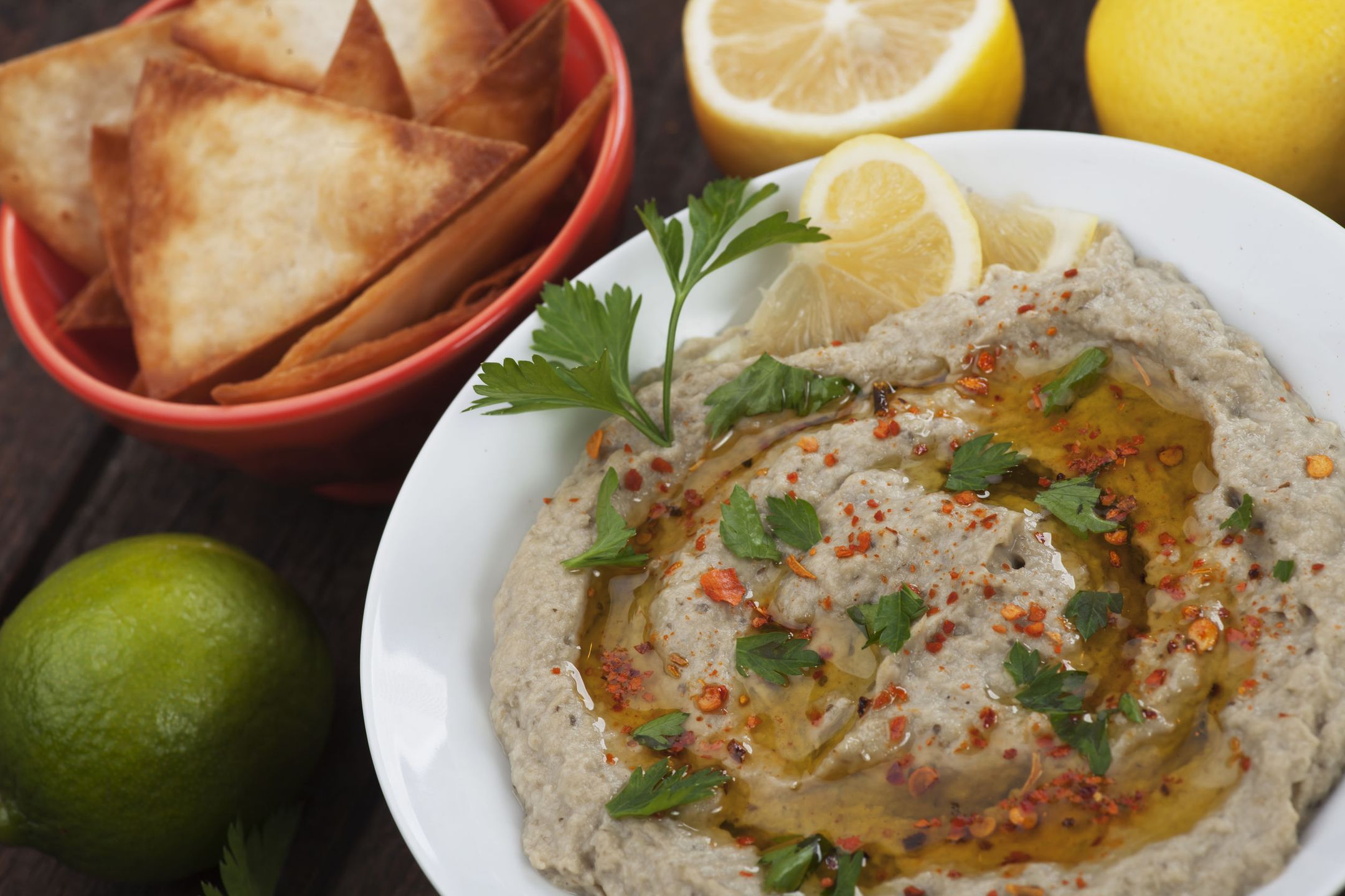 Baba ghanoush, levantine baked eggplant dip with olive oil and parsley 