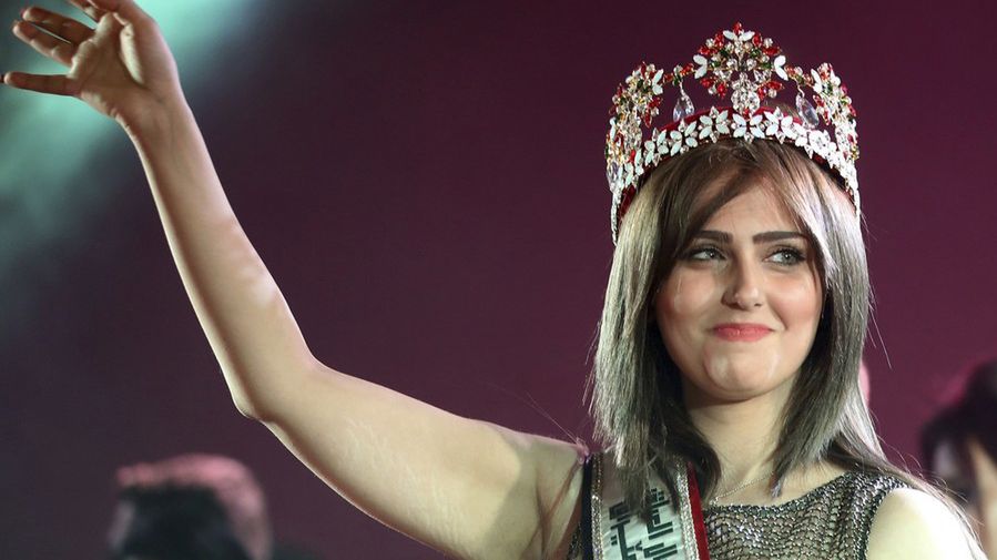 Newly crowned Miss Iraq, 20-year old Shaima Qassim, celebrates after being crowned at the end of the 2015 Miss Iraq Final in Baghdad, Iraq, Saturday, Dec. 19, 2015. (AP Photo/Karim Kadim)