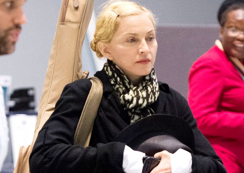 17 Jul 2014 - NEW YORK - USA

*** EXCLUSIVE PICTURES ***

SUPERSTAR SINGER MADONNA CARRYING A GUITAR CASE WITH HER SON ROCCO RITCHIE ARRIVING AT JFK AIRPORT IN NEW YORK

BYLINE MUST READ : XPOSUREPHOTOS.COM

***UK CLIENTS - PICTURES CONTAINING CHILDREN PLEASE PIXELATE FACE PRIOR TO PUBLICATION ***

**UK CLIENTS MUST CALL PRIOR TO TV OR ONLINE USAGE PLEASE TELEPHONE  44 208 344 2007**