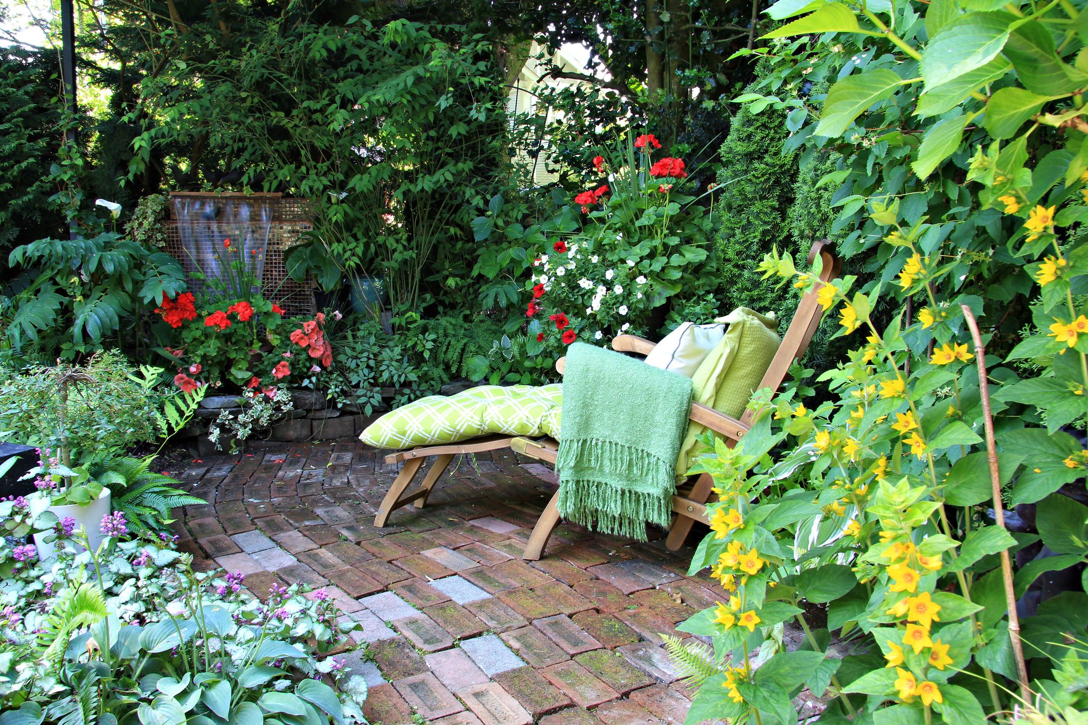 Comfortable lounge chair in a small private garden. Also available in vertical.  