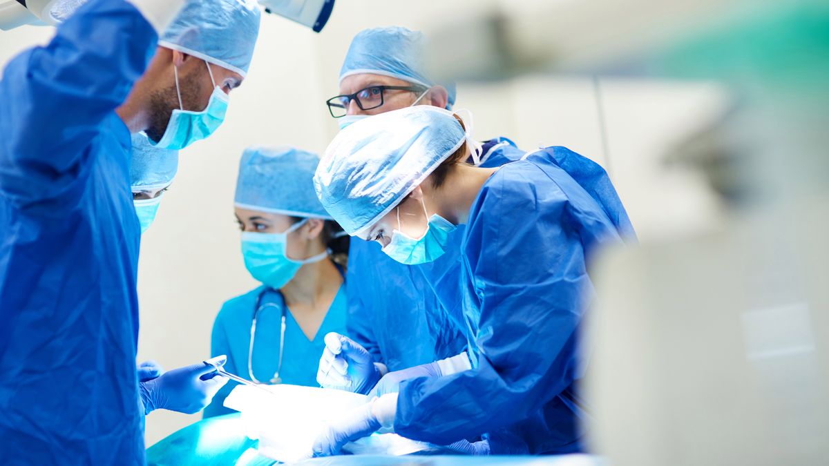 Close up of surgery team operating 