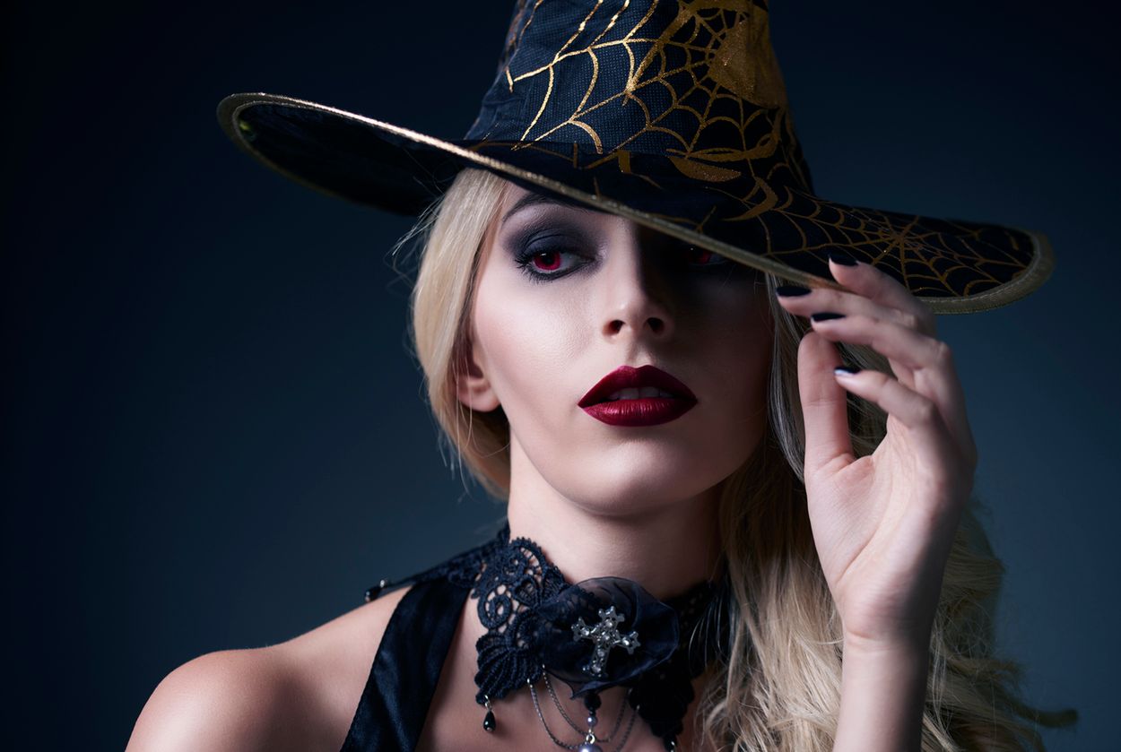 Women dressed up as a scary witch  