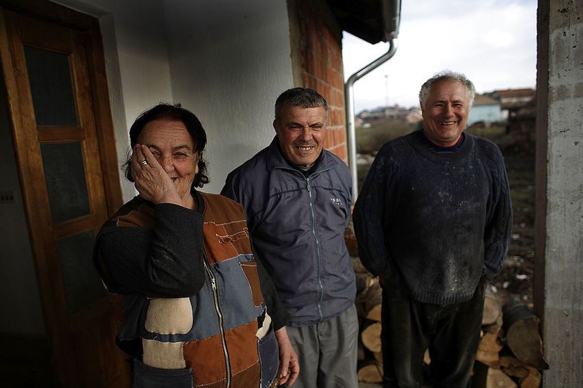 The in the war 1999 banished former serbian inhabitants Svetlana and her husband Radoica Georgevic stay after her comeback in front of her new built house on the own ground on December 13, 2007 in Polje, near Pristina, in breakaway province Kosovo, Serbia. The couple fled in the serbian village Razkov, after which their house was totaly burned out. 8 years later they are very happy to come back to their hometown. The new building was part of a project of 40 new built houses for returning serbian families on their former ground by the Kosovo government and the United Nation mission in Kosovo.The U.N. mission in Kosovo accused Serbia on Wednesday of "provocation" by opening a Serbian government office in the Serb north. Kosovo's ethnic Albanian majority says it will begin talks with its Western backers on a declaration of independence from Serbia in early 2008. 