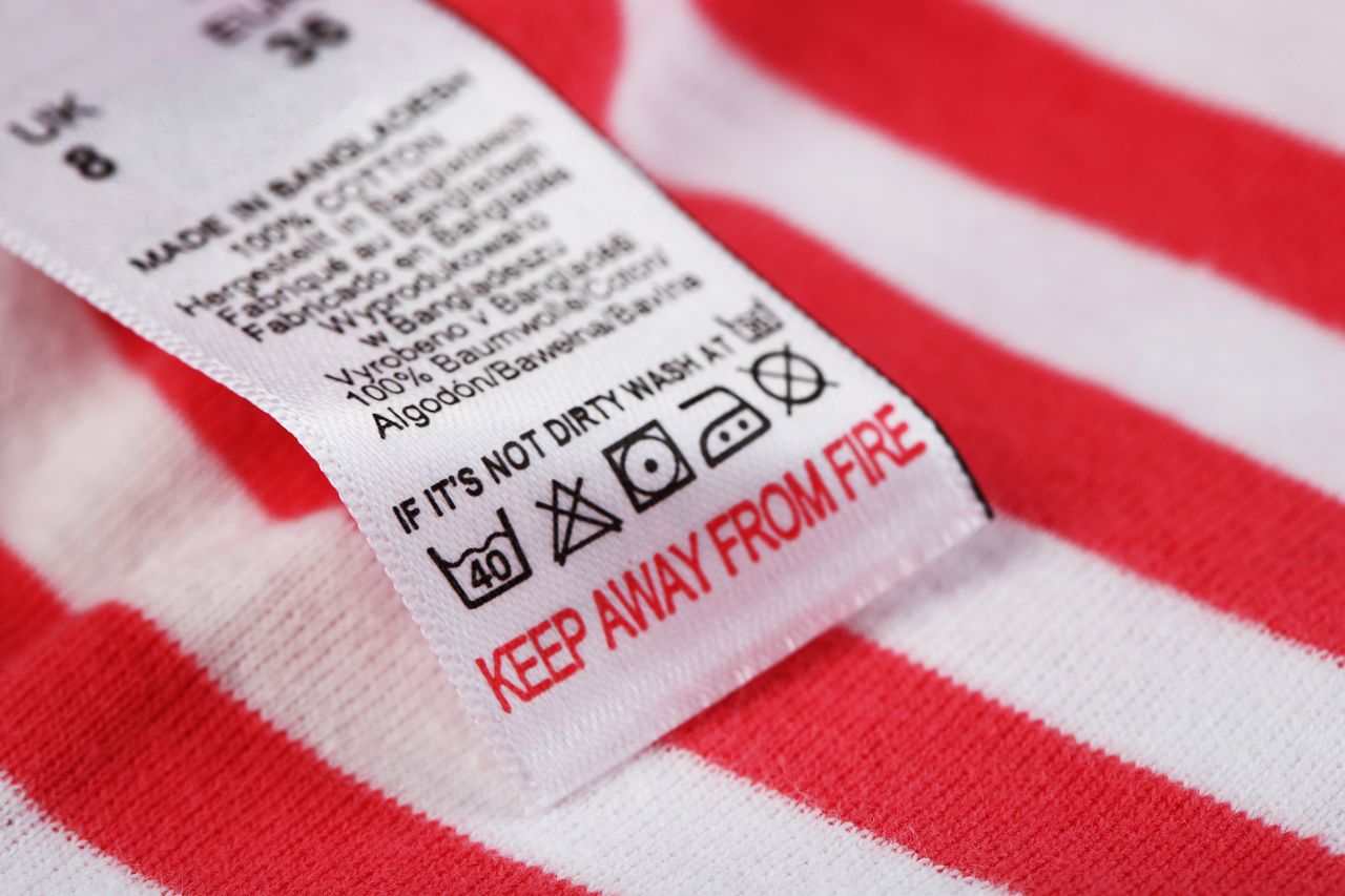 Label with laundry care symbols close-up on clothing
