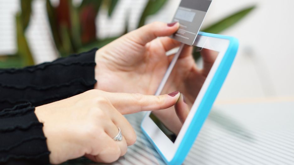 Woman holding tablet pc and credit card , Internet Shopping Concept