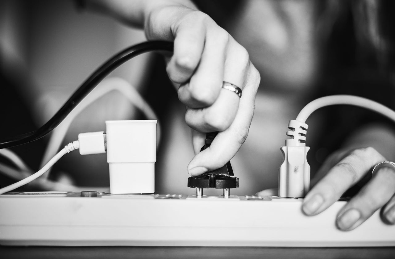 Woman plugging in a wire