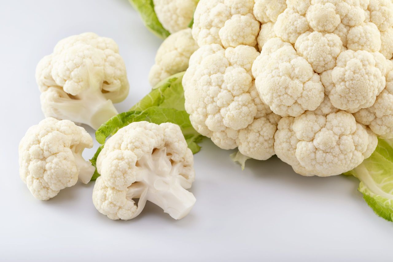 Ripe fresh cauliflower, isolated on white background. Healthy eating concept.