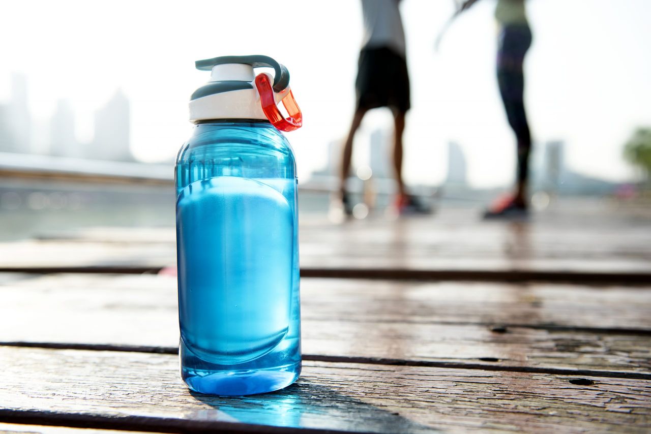 Bottle of water on plank in a park