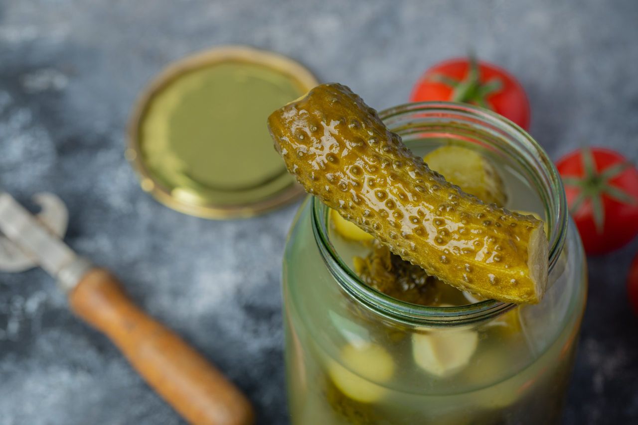 Opened pickle jar. Pickle on jar . High quality photo