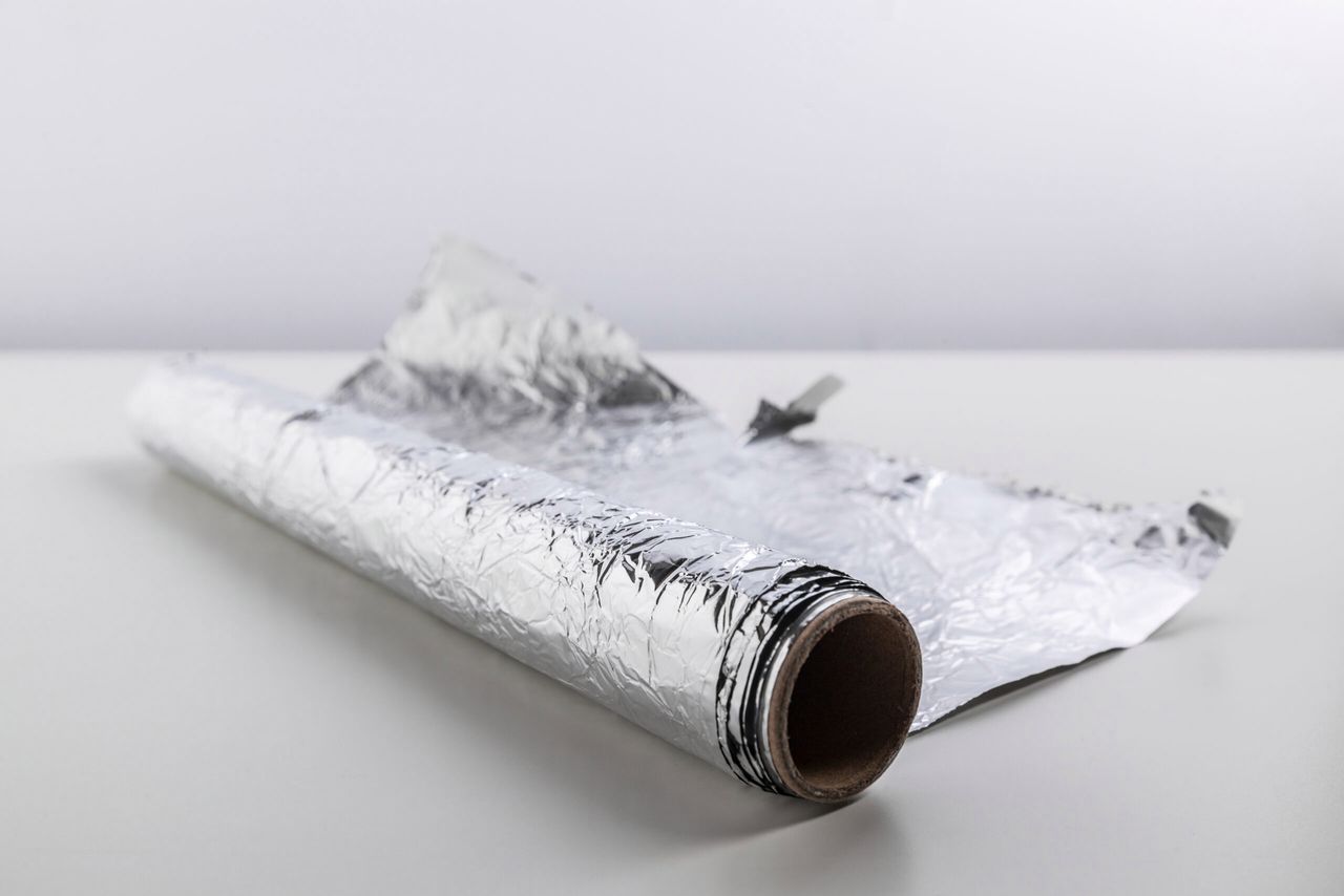 roll of aluminum foil isolated on white background