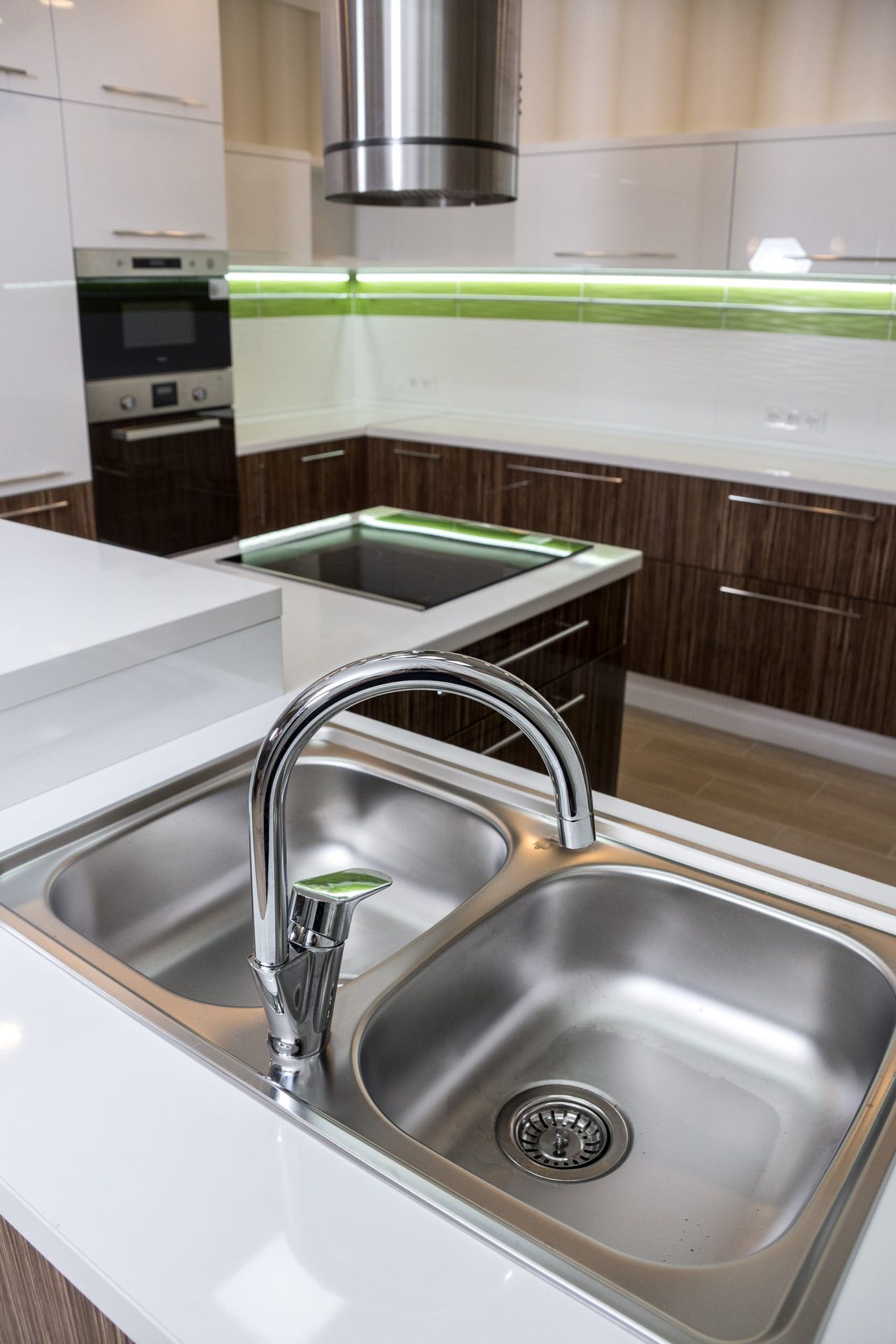 A double bowl stainless steel kitchen sink in a modern style