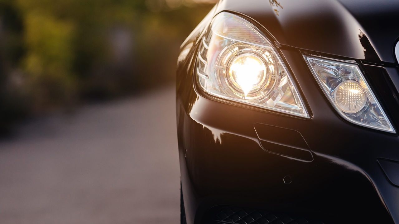 Modern luxury car headlights closeup.
