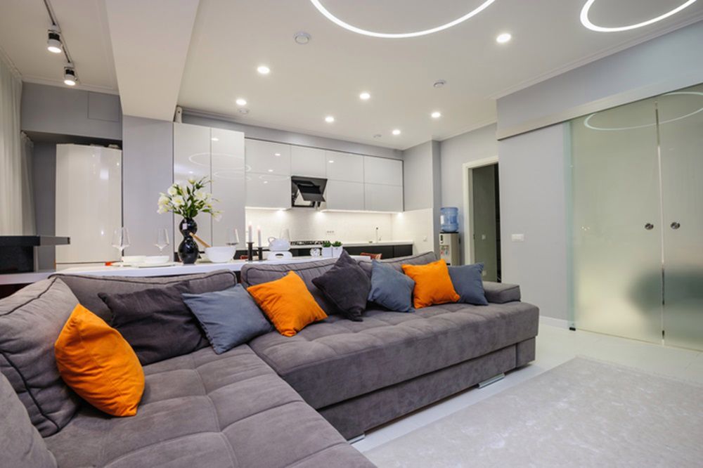 Modern designer white studio apartment interior, kitchen and living room toghether 