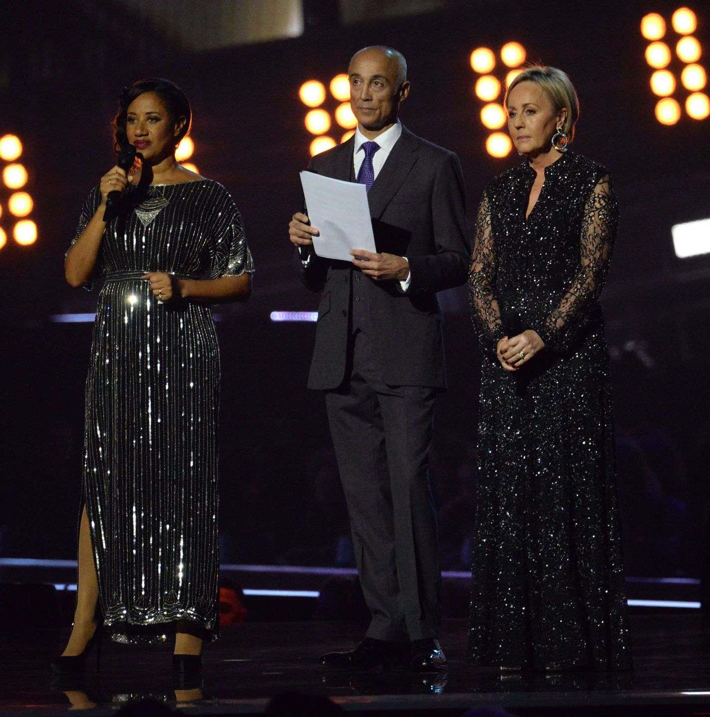 LONDON, ENGLAND - FEBRUARY 22: Pepsi DeMacque, Andrew Ridgeley and Shirlie Holliman of the band Wham! present a tribute to the late singer and former band mate George Michael live on stage at The BRIT Awards 2017 at The O2 Arena on February 22, 2017 in London, England.CAP/DH©DH/Capital Pictures
