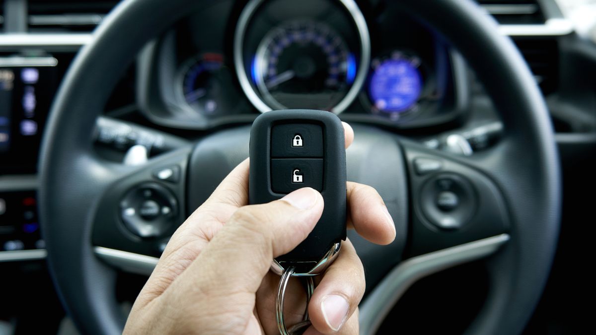 car key on hand inside the car