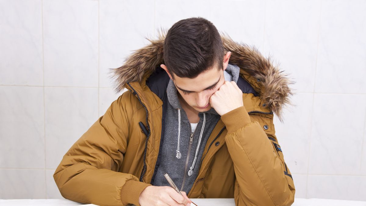 young man studying in the table