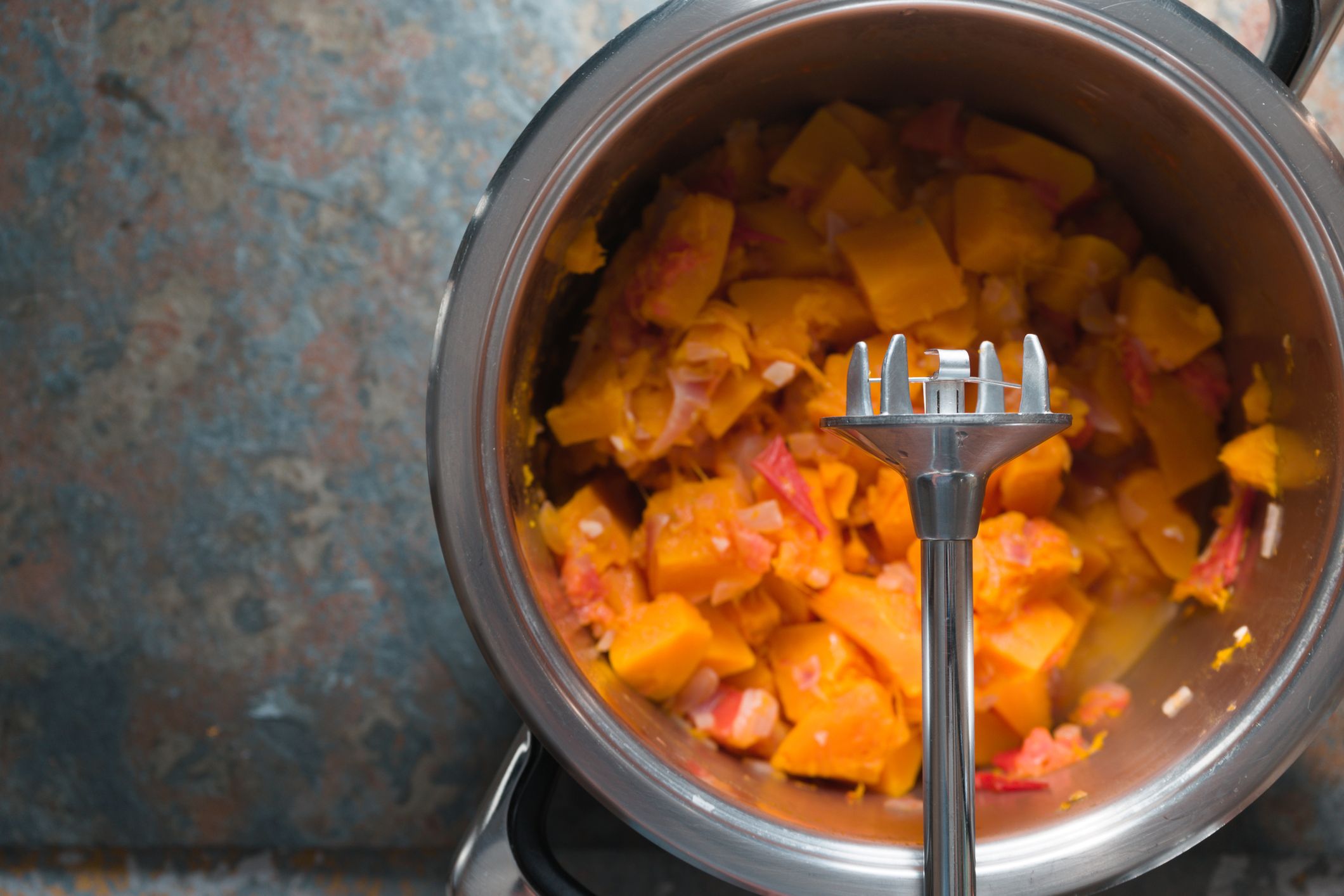 Casserole with ingredients for pumpkin soup and blender horizontal 