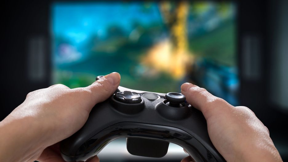 gaming game play tv fun gamer gamepad guy controller video console playing player holding hobby playful enjoyment view concept - stock image